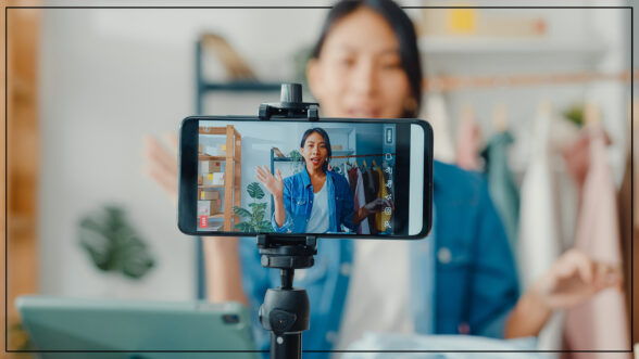Image of a Chinese woman livestreaming shopping on her phone